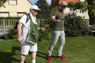 The golf pro has a caddy for carrying his heavy stuff.